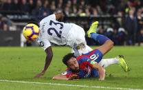 Cardiff City's Kadeem Harris, left and Crystal Palace's Andros Townsend battle for the ball, during the English Premier League soccer match between Crystal Palace and Cardiff City at Selhurst Park, in London, Wednesday Dec. 26, 2018. (Yui Mok/PA via AP)