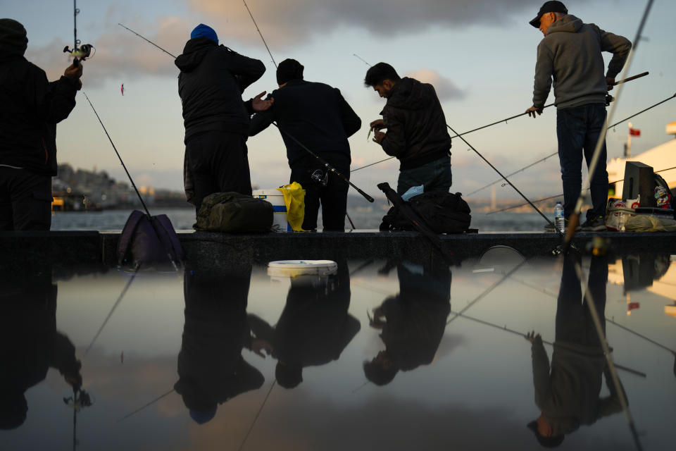 Local fishermen cast their lines into the Bosphorus in Istanbul, Turkey, Tuesday, May 23, 2023. Two opposing visions for Turkey’s future are on the ballot when voters return to the polls Sunday for a runoff presidential election, which will decide between an increasingly authoritarian incumbent President Recep Tayyip Erdogan and challenger Kemal Kilicdaroglu, who has pledged to restore democracy. (AP Photo/Francisco Seco)