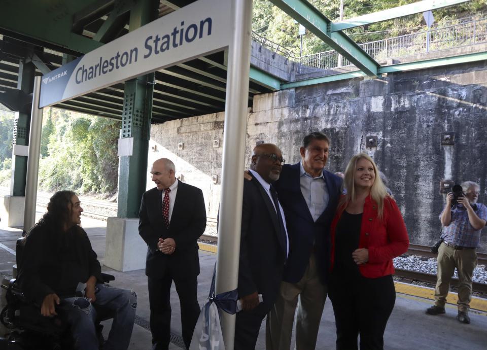 West Virginia Democratic Sen. Joe Manchin poses for a photo outside the newly renovated Amtrak train station in Charleston, W.Va. on Thursday, Oct. 12, 2023 (AP Photo/Leah Willingham)