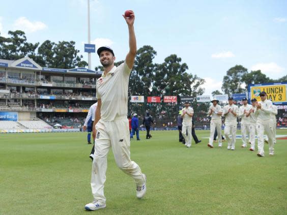 Mark Wood holds the ball aloft after taking five wickets (Getty Images)