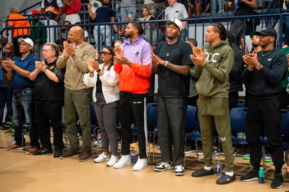 NBA star Devin Booker’s teammates on the Phoenix Suns clap for their teammate during a ceremony for the retirement of Booker’s high school jersey at Moss Point High School in Moss Point on Saturday, Dec. 10, 2022.