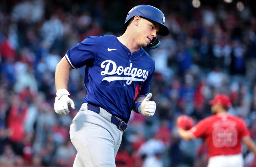 ANAHEIM, CALIFORNIA - MARCH 26: Dodgers Will Smith trots around the bases after hitting a solo home run in the fourth inning at Angels Stadium Tuesday. (Wally Skalij/Los Angeles Times)