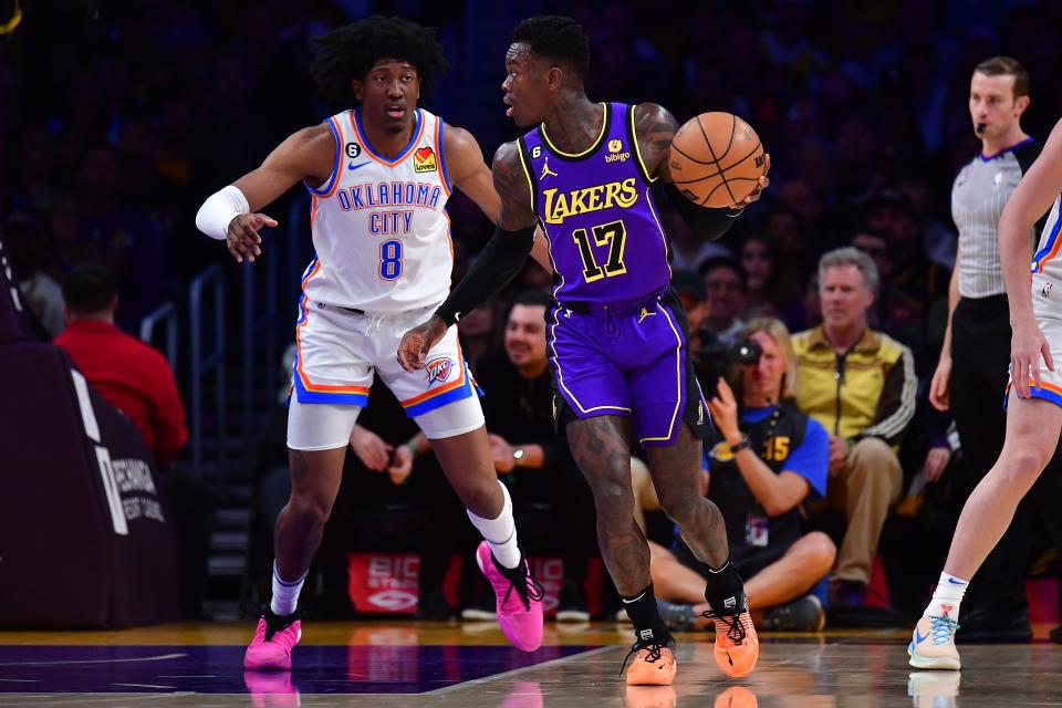 Los Angeles Lakers guard Dennis Schroder (17) moves the ball against Oklahoma City Thunder forward Jalen Williams (8) during the first half of Friday's game at Crypto.com Arena in Los Angeles.