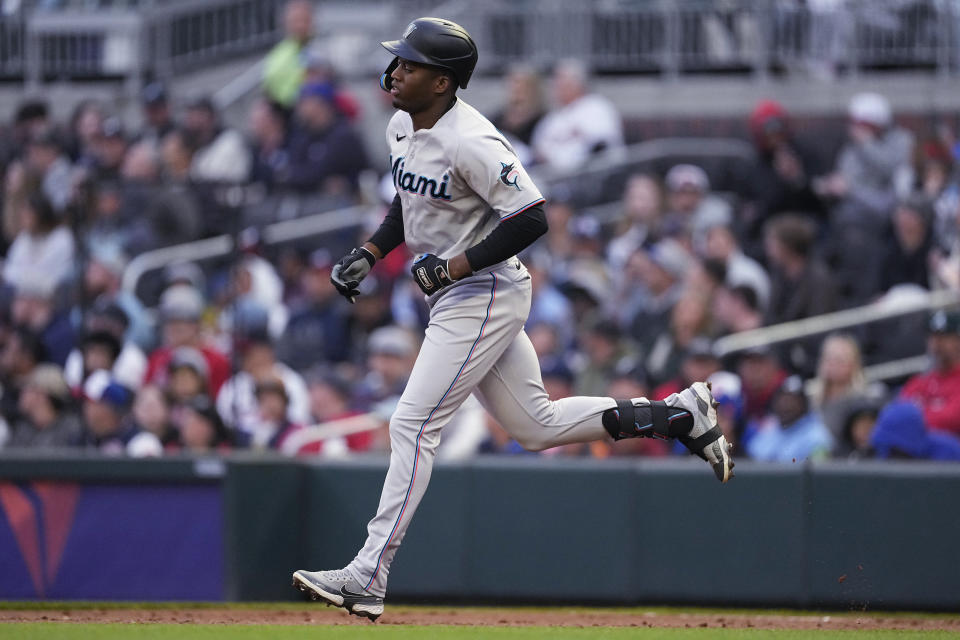 CORRECTS TO JESUS SANCHEZ, INSTEAD OF JAZZ CHISHOLM JR. - Miami Marlins' Jesus Sanchez runs the bases after hitting a solo home run against the Atlanta Braves during the second inning of a baseball game Wednesday, April 26, 2023, in Atlanta. (AP Photo/John Bazemore)