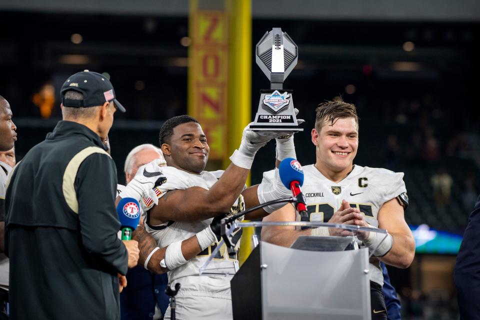 Army defensive lineman Nolan Cockrill (95) accepts the Armed Forces Bowl trophy in December. JEROME MIRON/USA TODAY Sports