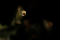 <p>A water drop hangs on a stalactite along the bank of the River Thames during low tide in London, Britain on Feb. 24, 2017. (Photo: Stefan Wermuth/Reuters) </p>