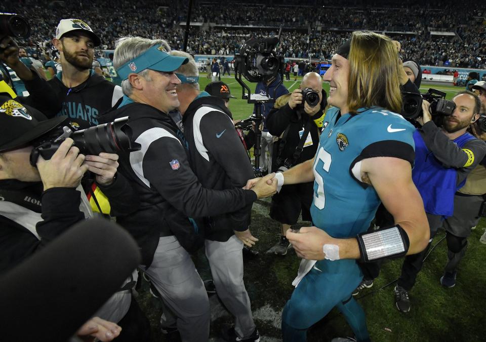 Jaguars head coach Doug Pederson and quarterback Trevor Lawrence greet each other after their win over the Tennessee Titans clinched the AFC South title, Saturday, Jan. 7, 2023, in Jacksonville.