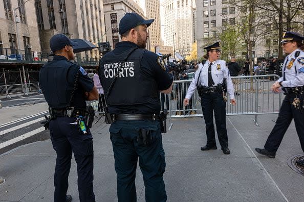 NEW YORK, NEW YORK - APRIL 15: Police and media gather outside of a the Manhattan Criminal Courthouse for the start of first-ever criminal trial against a former president of the United States on April 15, 2024 in New York City. Former President Donald Trump faces 34 felony counts of falsifying business records in the first of his criminal cases to go to trial. (Photo by Spencer Platt/Getty Images)