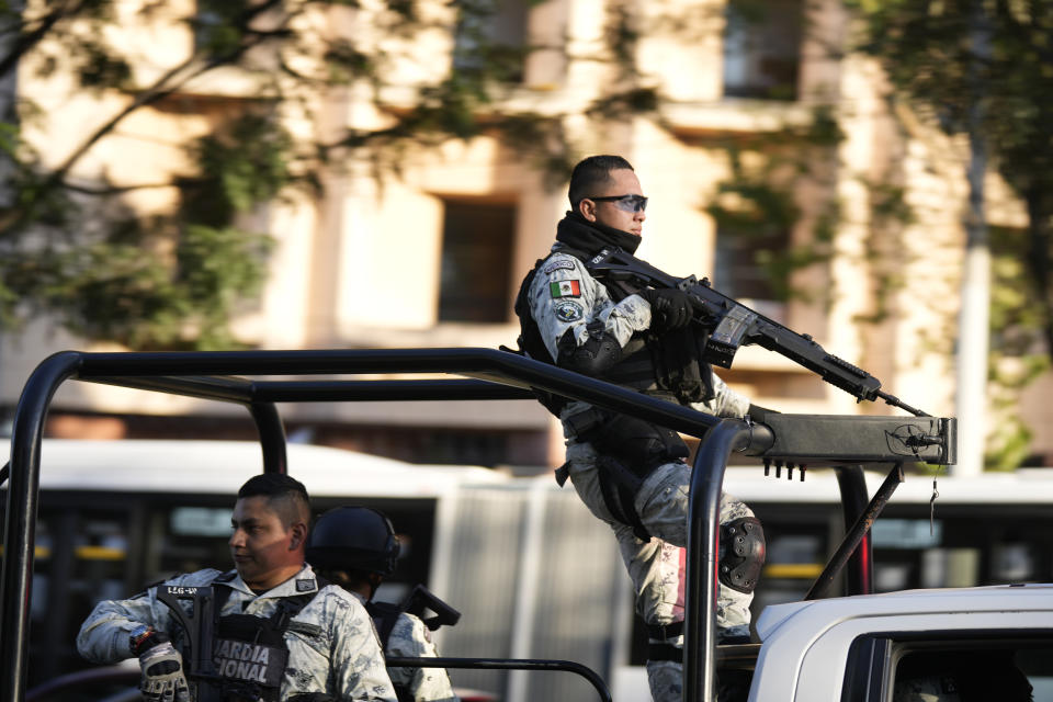 Security personnel guard the prosecutor's building where Ovidio Guzmán, one of the sons of former Sinaloa cartel boss Joaquin "El Chapo" Guzmán, is in custody in Mexico City, Thursday, Jan. 5, 2023. The Mexican military has captured Ovidio Guzman during a operation outside Culiacan, a stronghold of the Sinaloa drug cartel in western Mexico. (AP Photo/Fernando Llano)