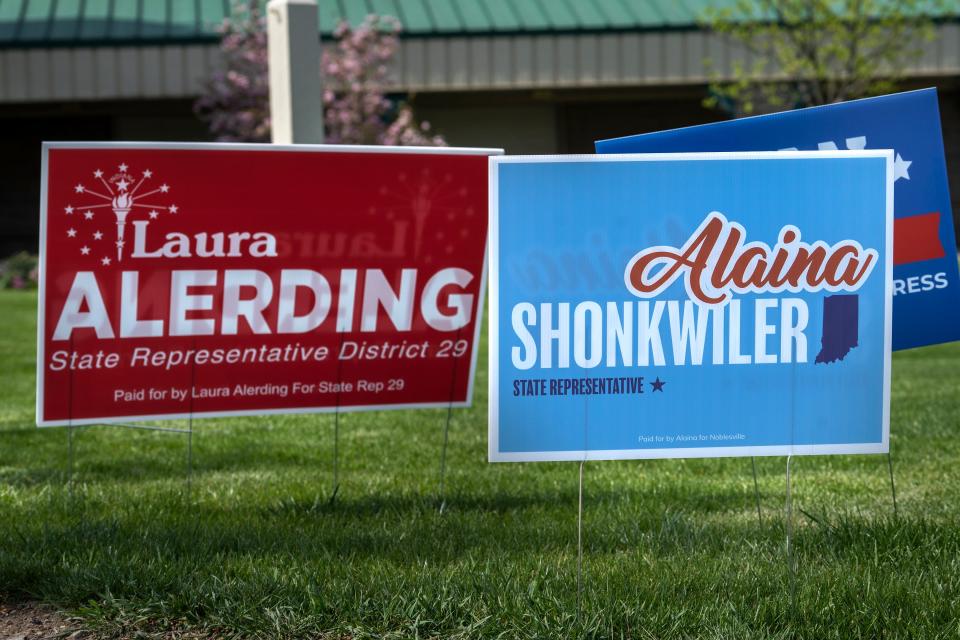 Candidate signs, including those for State Representative candidates Laura Alerding and Alaina Shonkwiler, line the walkway up to the Hamilton County Fairgrounds polling site for voters to see before early voting Tuesday, April 16, 2024 in Noblesville. The primary election is on May 7, 2024.