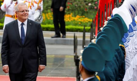 Australia's Prime Minister Scott Morrison reviews the guard of honour during a welcoming ceremony in Hanoi