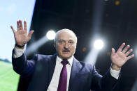 Belarusian President Alexander Lukashenko gestures as he addresses a women's forum in Minsk, Belarus, Thursday, Sept. 17, 2020. President Alexander Lukashenko's decision to close the borders with Poland and Lithuania underlines his repeated claim that the massive wave of protests is driven by the West and comes amid increasing criticism from the United States and the European Union. (TUT.by via AP)