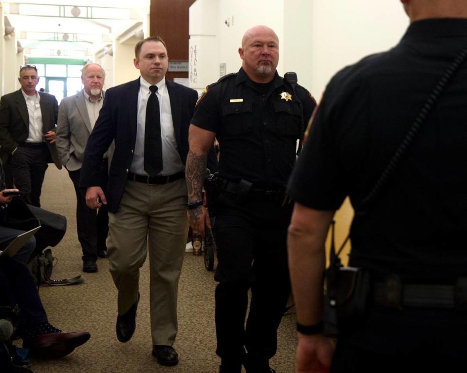 Aaron Dean walks in to a pretrial hearing Nov. 16, 2022, at Tim Curry Criminal Justice Center in downtown Fort Worth. Dean, a former Fort Worth police officer, is scheduled for trial Monday on a murder charge in the shooting death of Atatiana Jefferson.