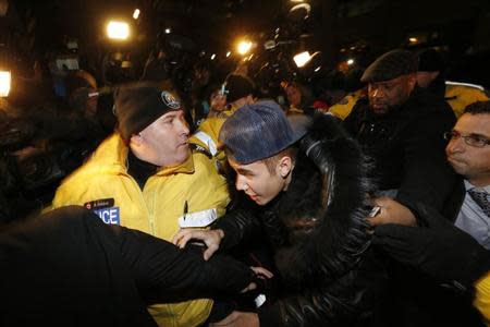 Pop singer Justin Bieber arrives at a police station in Toronto January 29, 2014. REUTERS/Alex Urosevic