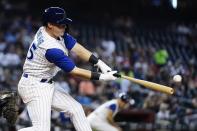 Arizona Diamondbacks' Andrew Young hits an RBI double against the Seattle Mariners during the seventh inning of a baseball game Friday, Sept. 3, 2021, in Phoenix. (AP Photo/Ross D. Franklin)