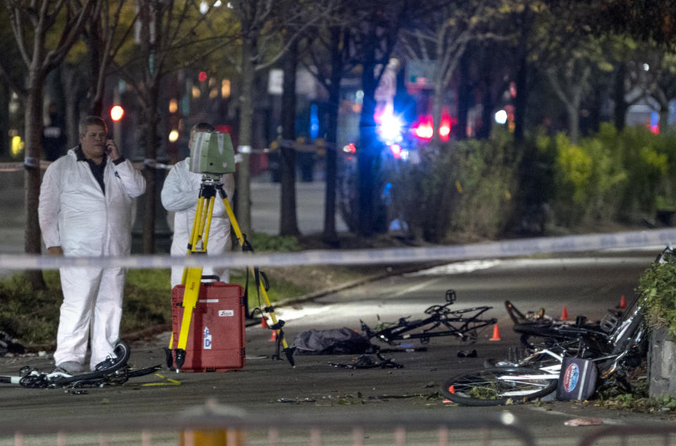 <p>Bicycles and debris lay on a bike path at the crime scene where investigators work after a motorist earlier in the day drove onto the path near the World Trade Center memorial, striking and killing several people, Oct. 31, 2017. (Photo: Craig Ruttle/AP) </p>