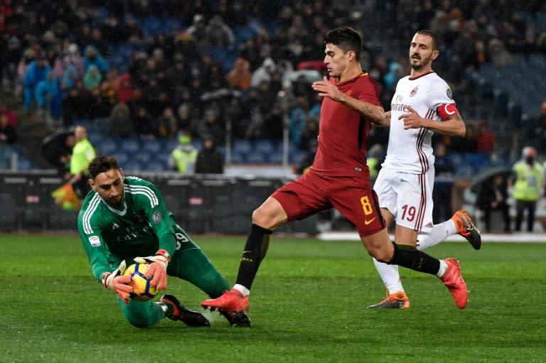 Birthday boy: AC Milan goalkeeper Gianluigi Donnarumma makes a save against Roma on his 19th birthday