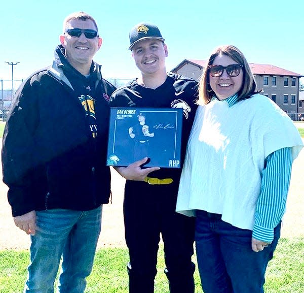 Marywood University pitcher Danny Becker pictured with his parents, Craig and Julie, during Senior Day ceremonies.