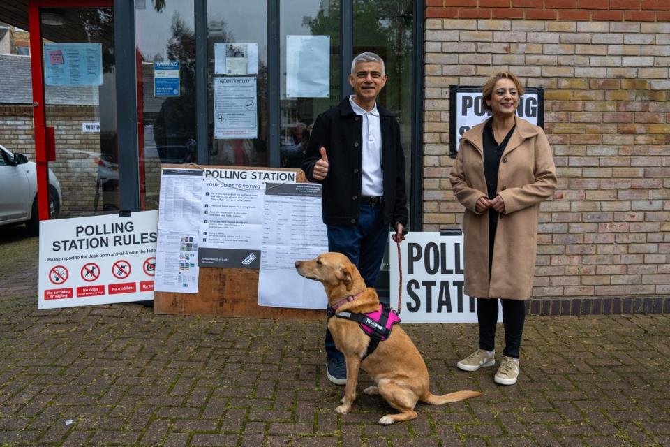 London Mayor Sadiq Khan and his wife Saadiya arrive with their dog Luna to cast their vote in the London mayoral election on Thursday (Getty Images)