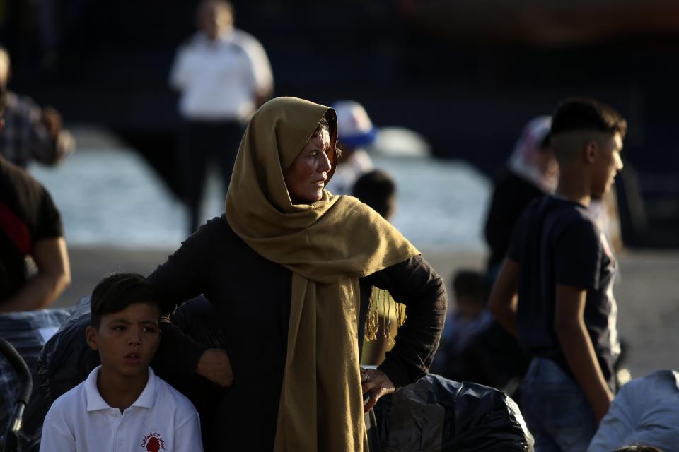 Refugees and migrants arrive at the port of Thessaloniki, northern Greece, Monday, Sept. 2, 2019. About 1,500 asylum-seekers were being transported from Greece's eastern Aegean island of Lesbos to the mainland Monday as part of government efforts to tackle massive overcrowding in refugee camps and a recent spike in the number of people arriving from the nearby Turkish coast. (AP Photo/Giannis Papanikos)