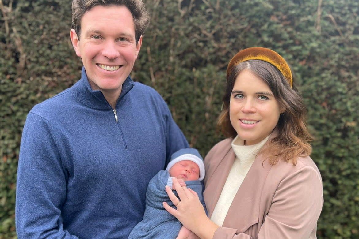 <p>Princess Eugenie and Jack Brooksbank pose with their son, August Philip Hawke Brooksbank, in this undated handout photo issued by Buckingham Palace on February 20,</p> (REUTERS)