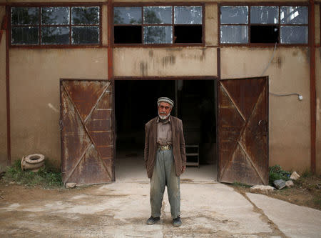 A worker at the Jabal Saraj cement factory poses for a photograph in Jabal Saraj, north of Kabul, Afghanistan April 19, 2016. REUTERS/Ahmad Masood