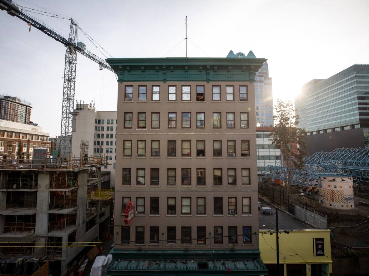 The Hotel Canada SRO is pictured from across the street in Vancouver. Renovated single-room occupancy housing is part of a range of new units coming for the neighbourhood. (Ben Nelms/CBC - image credit)