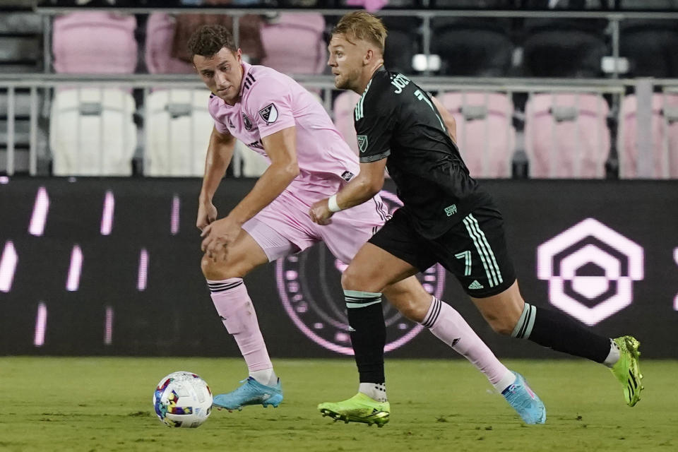 Charlotte FC midfielder Kamil Jóźwiak (7) and Inter Miami defender Christopher McVey go after the ball during the first half of an MLS soccer match, Saturday, July 16, 2022, in Fort Lauderdale, Fla. (AP Photo/Marta Lavandier)