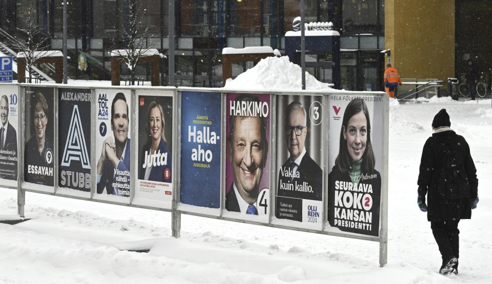 Election posters pictured ahead of the Finnish presidential election in Espoo, Finland, Thursday, Jan. 18, 2024. The first round of the presidential election takes place on Sunday, Jan. 28 but the advance voting period is from Jan. 17 to Jan. 23. (Heikki Saukkomaa/Lehtikuva via AP)