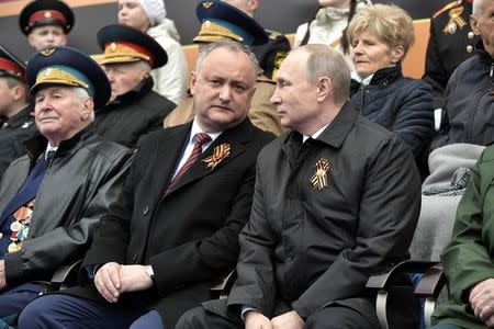 Moscow - Russia - 09/05/2017 - Russian President Vladimir Putin and Moldovan President Igor Dodon attend the Victory Day military parade marking the World War II anniversary at Red Square in Moscow. Sputnik/Aleksey Nikolskyi/Kremlin via REUTERS ATTENTION EDITORS - THIS IMAGE WAS PROVIDED BY A THIRD PARTY. EDITORIAL USE ONLY.