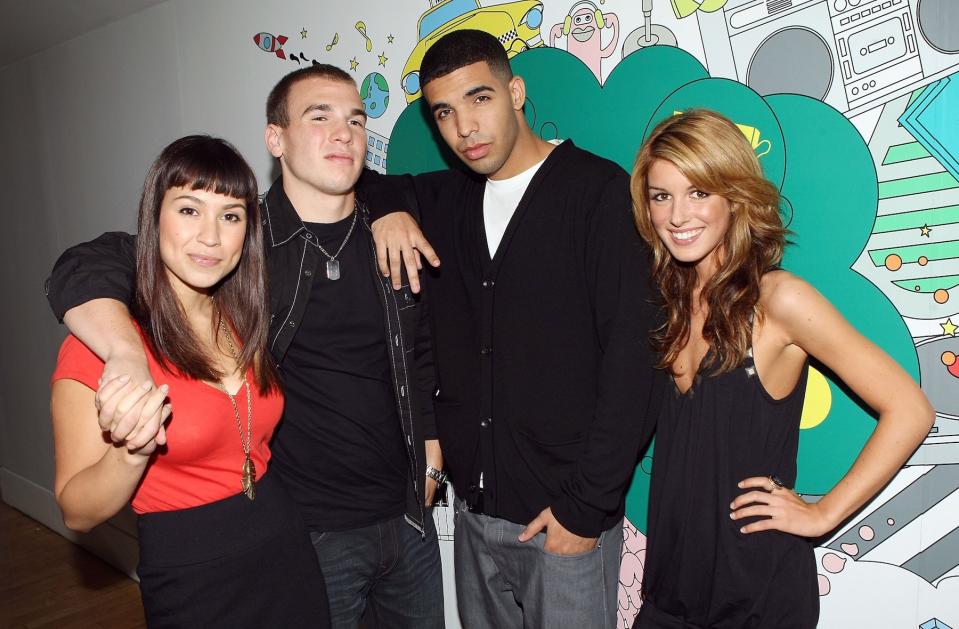 Actress Cassie Steele, actor Shane Kippel, actor Aubrey Graham and actress Shenae Grimes of the Cast of "DeGrassi High" pose for pictures while visiting MTV's "TRL" at MTV Studios in Times Square on October 2, 2007 in New York City. (Photo by Gary Gershoff/WireImage)