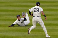 New York Yankees left fielder Clint Frazier holds the ball up after making a diving catch of a ball hit by Atlanta Braves' Ehire Adrianza during the third inning of a baseball game Wednesday, April 21, 2021, at Yankee Stadium in New York. (AP Photo/Kathy Willens)