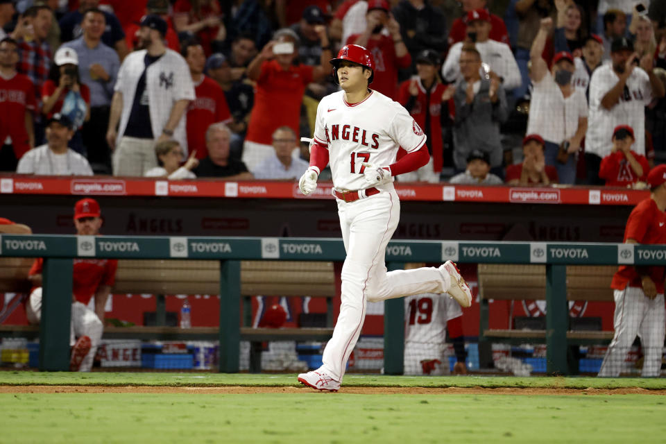 Los Angeles Angels' Shohei Ohtani runs home after hitting a home run during the fifth inning of a baseball game against the New York Yankees in Anaheim, Calif., Monday, Aug. 30, 2021. (AP Photo/Ringo H.W. Chiu)