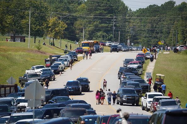 WINDER, GEORGIA - SEPTEMBER 4: Cars line the road as parents arrive to meet students after a shooting at Apalachee High School on September 4, 2024 in Winder, Georgia. Multiple fatalities and injuries have been reported and a suspect is in custody according to authorities. (Photo by Megan Varner/Getty Images)