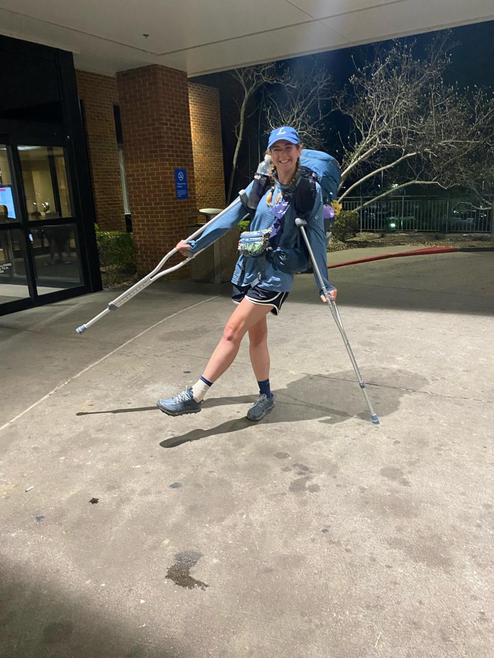 Poughkeepsie native Alexis Holzmann poses playfully with her crutches after suffering an ankle injury that required a hospital visit in April 2023 during her hike of the Appalachian Trail.