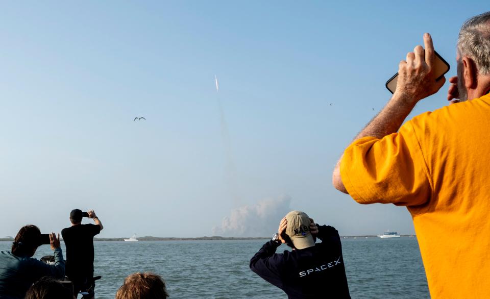 Spectators watch from South Padre Island, Texas, as the SpaceX Starship launches for a flight test from Starbase in Boca Chica, Texas, on April 20, 2023.