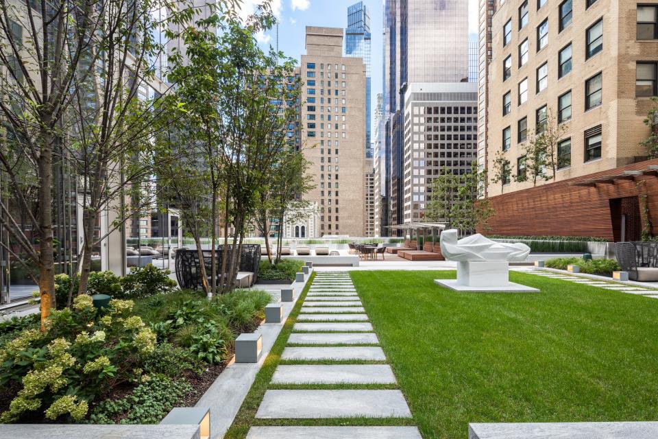 an outdoor green area and planter on the 14th floor of luxury skyscraper Central Park Tower