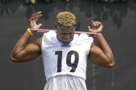 Pittsburgh Steelers wide receiver JuJu Smith-Schuster (19) uses bands during an NFL football practice, Saturday, July 24, 2021, in Pittsburgh. (AP Photo/Keith Srakocic)