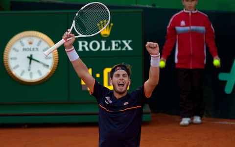British Cameron Norrie celebrates after winning against Spain's Roberto Bautista during the first round of the Davis Cup tennis match between Spain and Great Britain at the Puente Romano tennis club in Marbella - Credit: JORGE GUERRERO/AFP/Getty Images
