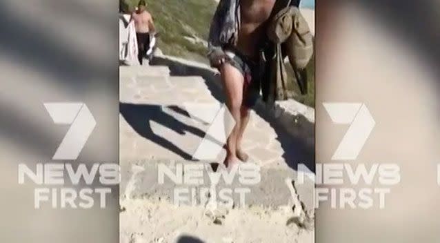 A few hours after the first attack, surfers ignored the beach closures and got back in the water. Photo: 7 News