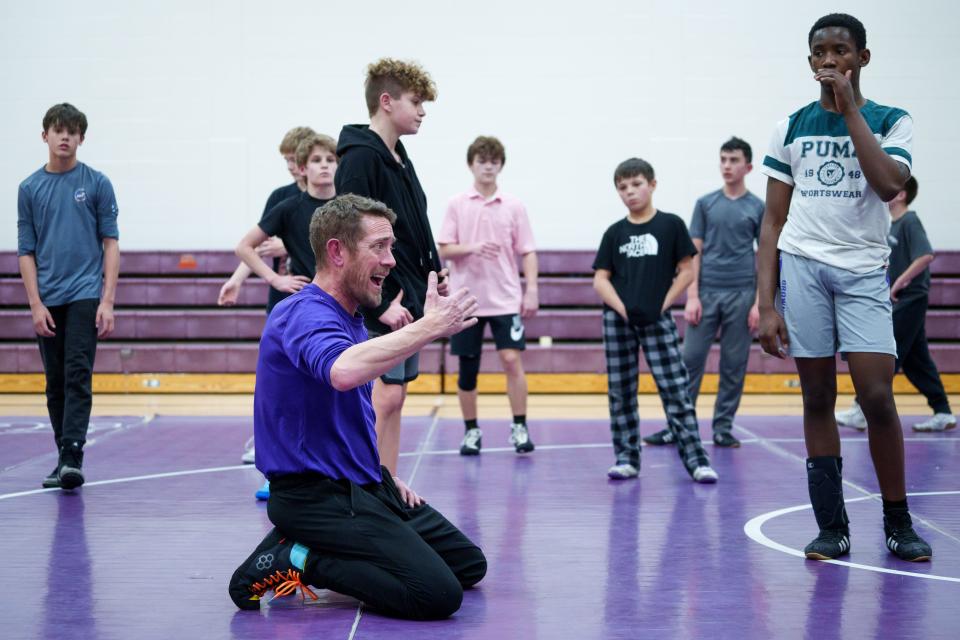 Brownsburg West Middle School Bulldogs wrestling coach Patrick Frepan talks about the team's next drill Tuesday, Feb. 26, 2024, during practice ahead of the Bulldogs' conference meet Saturday.