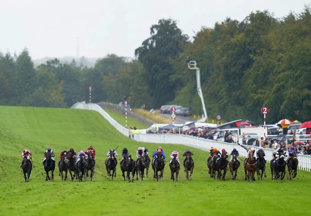 Runners and riders in action as they compete in the Coral Stewards’ Cup during day five of the Qatar Goodwood Festival