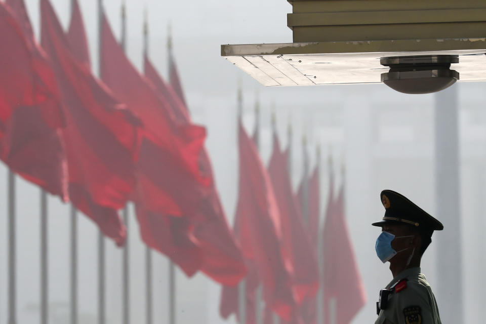 A Chinese paramilitary policeman stands guard near Tiananmen Square before the opening session of China's National People's Congress (NPC) at the Great Hall of the People in Beijing, Friday, May 22, 2020. (AP Photo/Ng Han Guan, Pool)