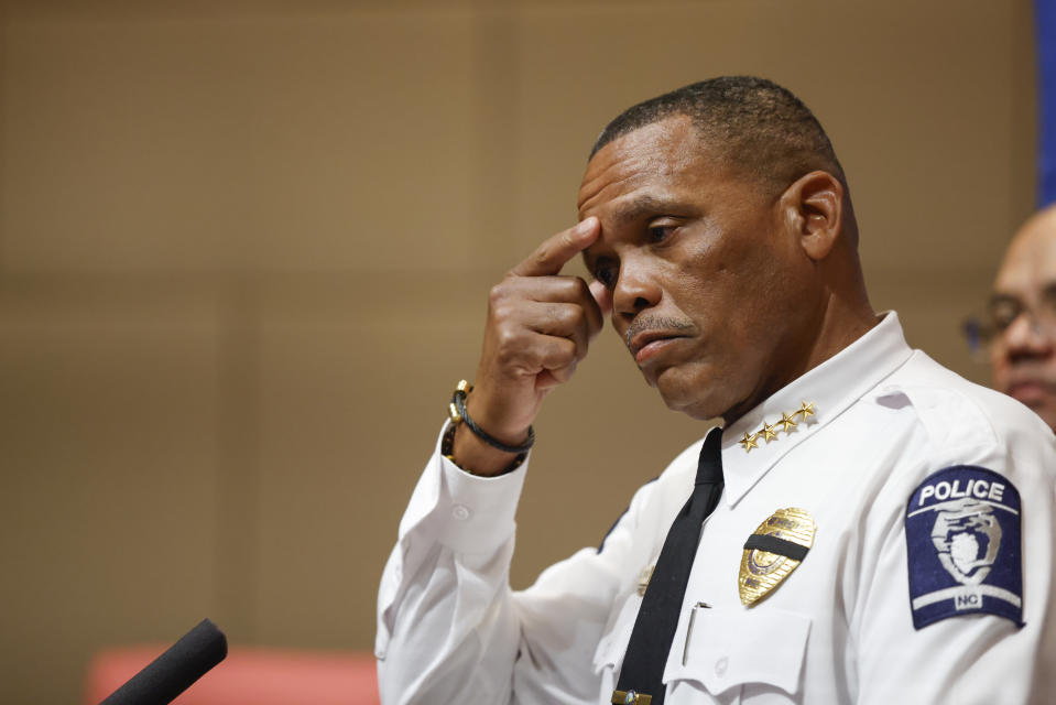Charlotte-Mecklenburg Police Chief Johnny Jennings pauses to compose himself during a press conference in Charlotte, N.C., Tuesday, April 30, 2024, regarding a shooting that killed four officers during an attempt to serve a warrant on April 29. (AP Photo/Nell Redmond)