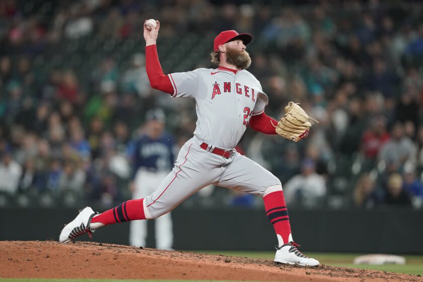 Los Angeles Angels closing pitcher Archie Bradley throws against the Seattle Mariners.