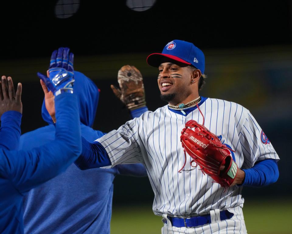 Iowa Cubs right fielder Christopher Morel celebrates with teammates after a March 31 victory at Principal Park in Des Moines.