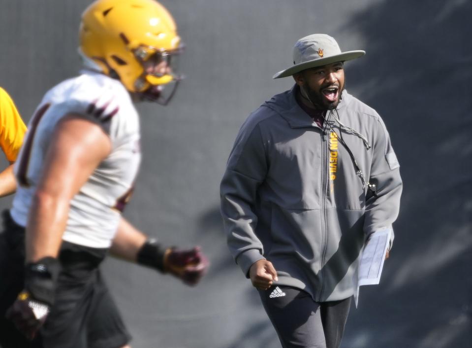 Arizona State Sun Devils WR coach/passing game coordinator Ra'Shaad Samples instructs his players during spring football practice at the Kajikawa practice fields in Tempe on March 16, 2023.