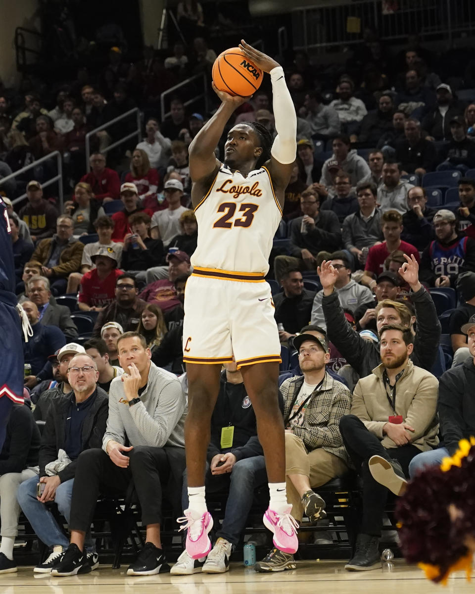 FILE - Loyola's Philip Alston shoots during an NCAA college basketball game against Florida Atlantic Wednesday, Nov. 8, 2023, in Chicago. Loyola is tied with Richmond for the league lead, with No. 16 Dayton a half game back. It’s a welcomed change for the Ramblers after finishing last in the Atlantic 10 a year ago following a move from the Missouri Valley Conference. The Ramblers have their sights set on the NCAA Tournament.(AP Photo/Charles Rex Arbogast, File)