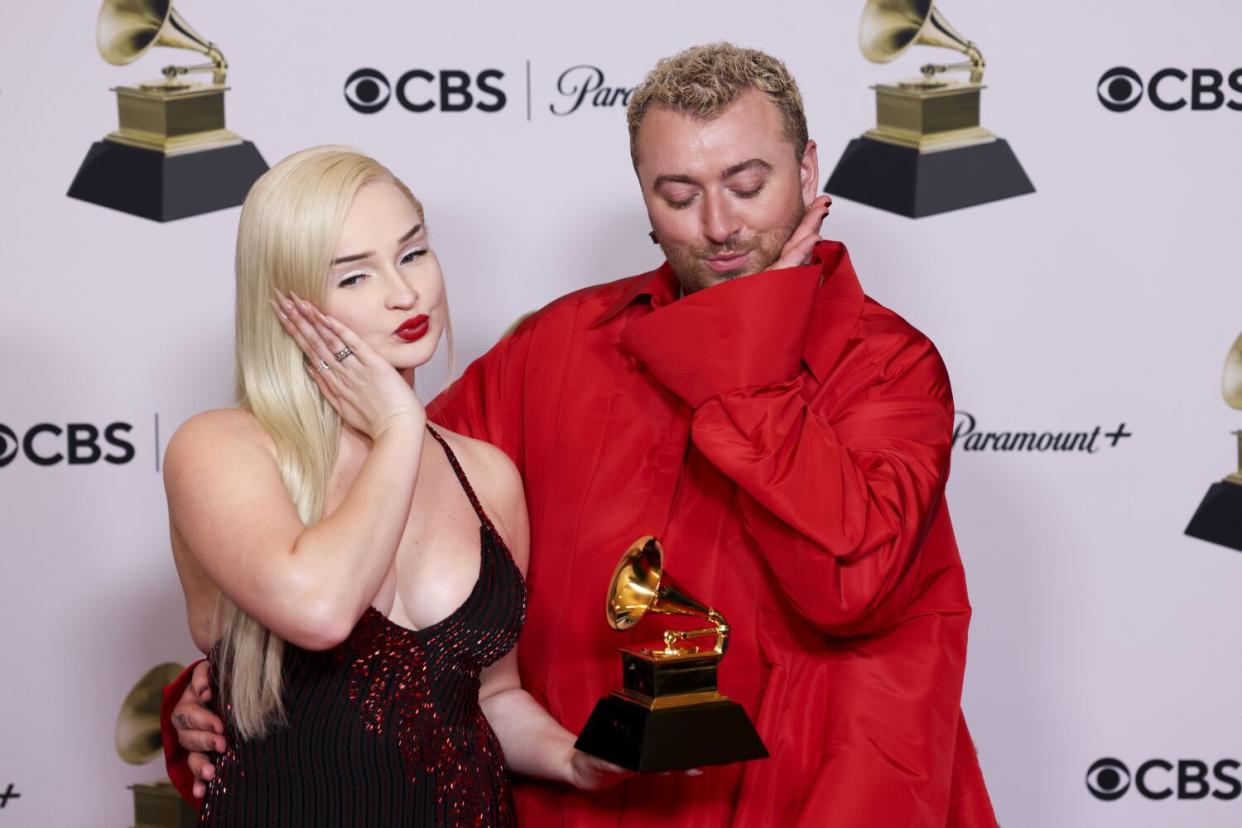 Kim Petras and Sam Smith stand with their trophy at the 65th Grammy Awards