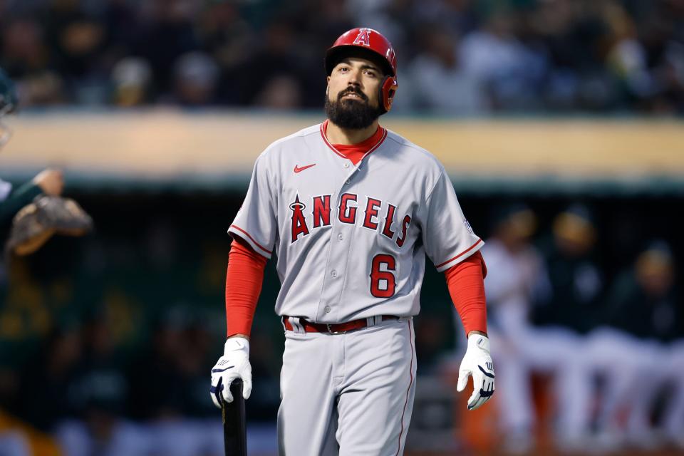 Anthony Rendon walks to the dugout during the Angels'  opening day game against the A's.